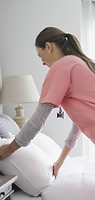 Home Nurse Making Bed