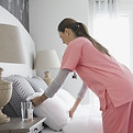 Home Nurse Making Bed