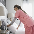 Home Nurse Making Bed