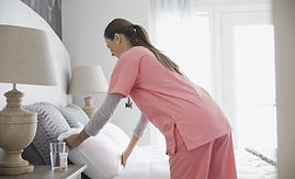 Home Nurse Making Bed