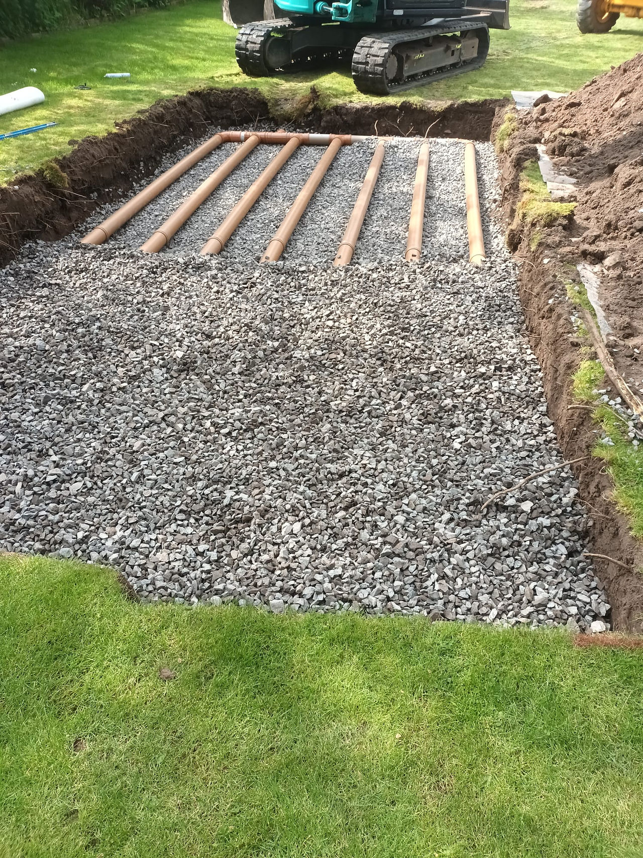 soakaway pipes and top gravel at new installation in acton trussel