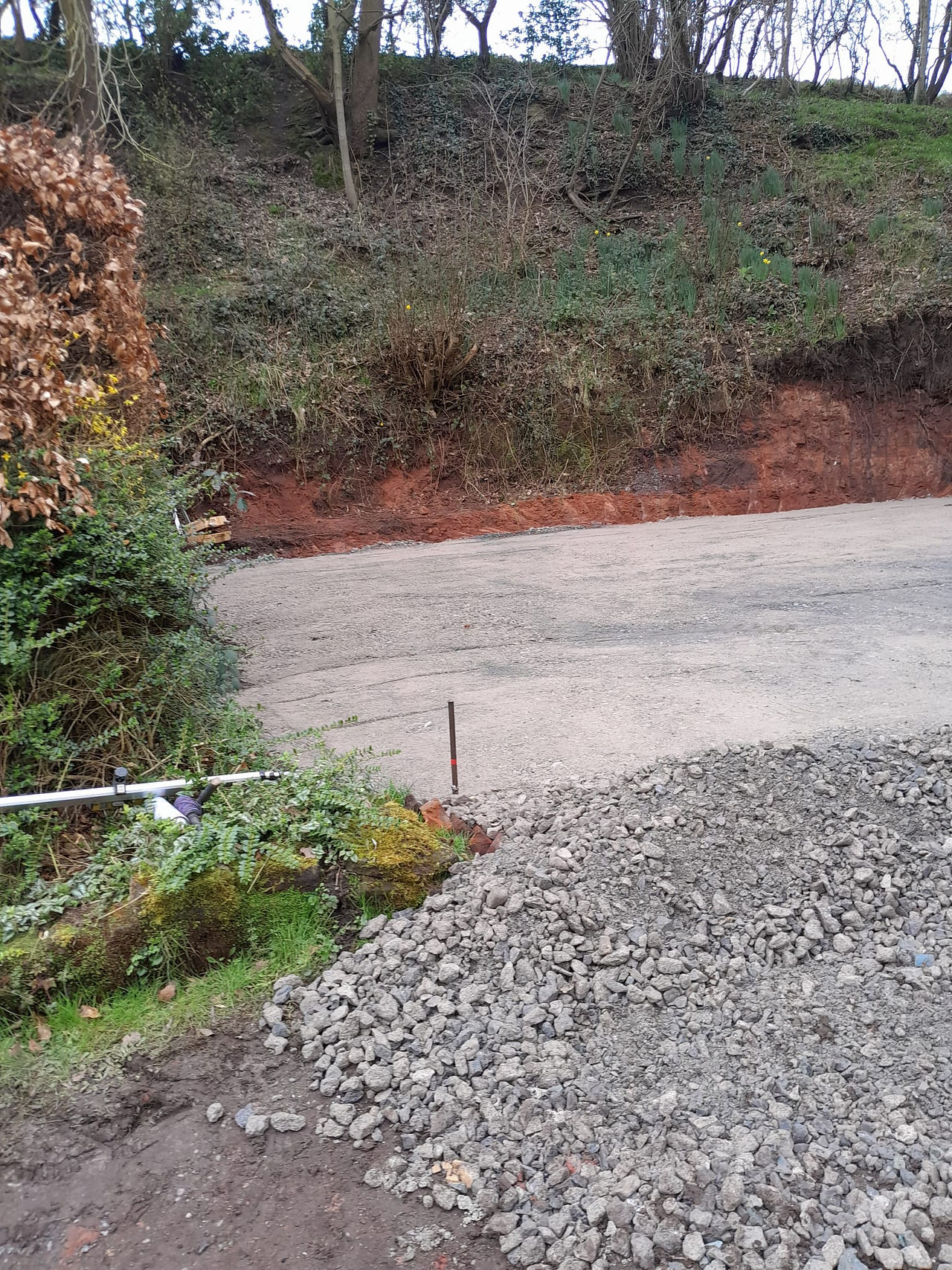 distant view of a cement platform with hardcore pile to the front