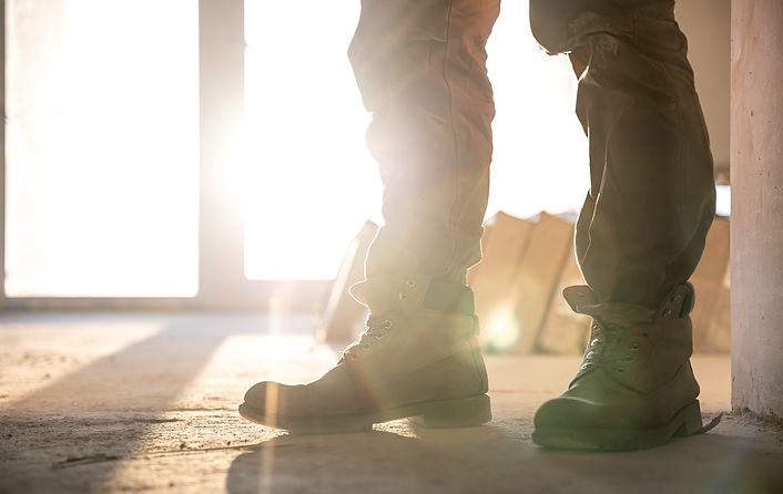 close-up-of-builder-in-work-clothes-and-boots-close-up-part-of-the-body.jpg
