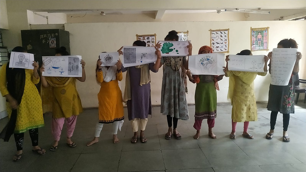 Through their drawings, each girl shared one way to protect nature.