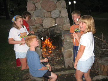 roasting marshmallows over a wood fire, Nevis, Minnesota