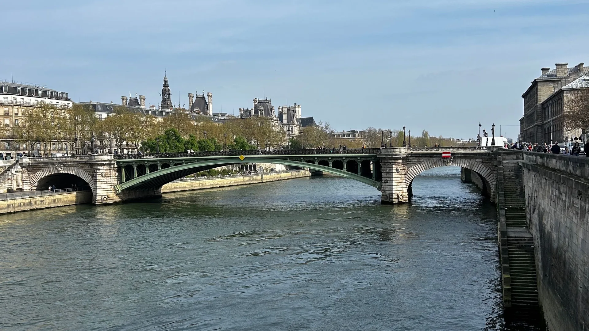 The Seine river, a bridge and historic architecture in Paris