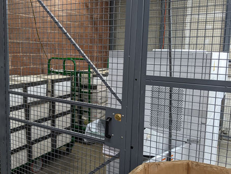 Private documents kept in a fully enclosed security cage awaiting destruction.