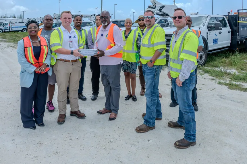 Minister of Energy and Transport Pike Corporation (Island Grid) bucket trucks on Tuesday.  