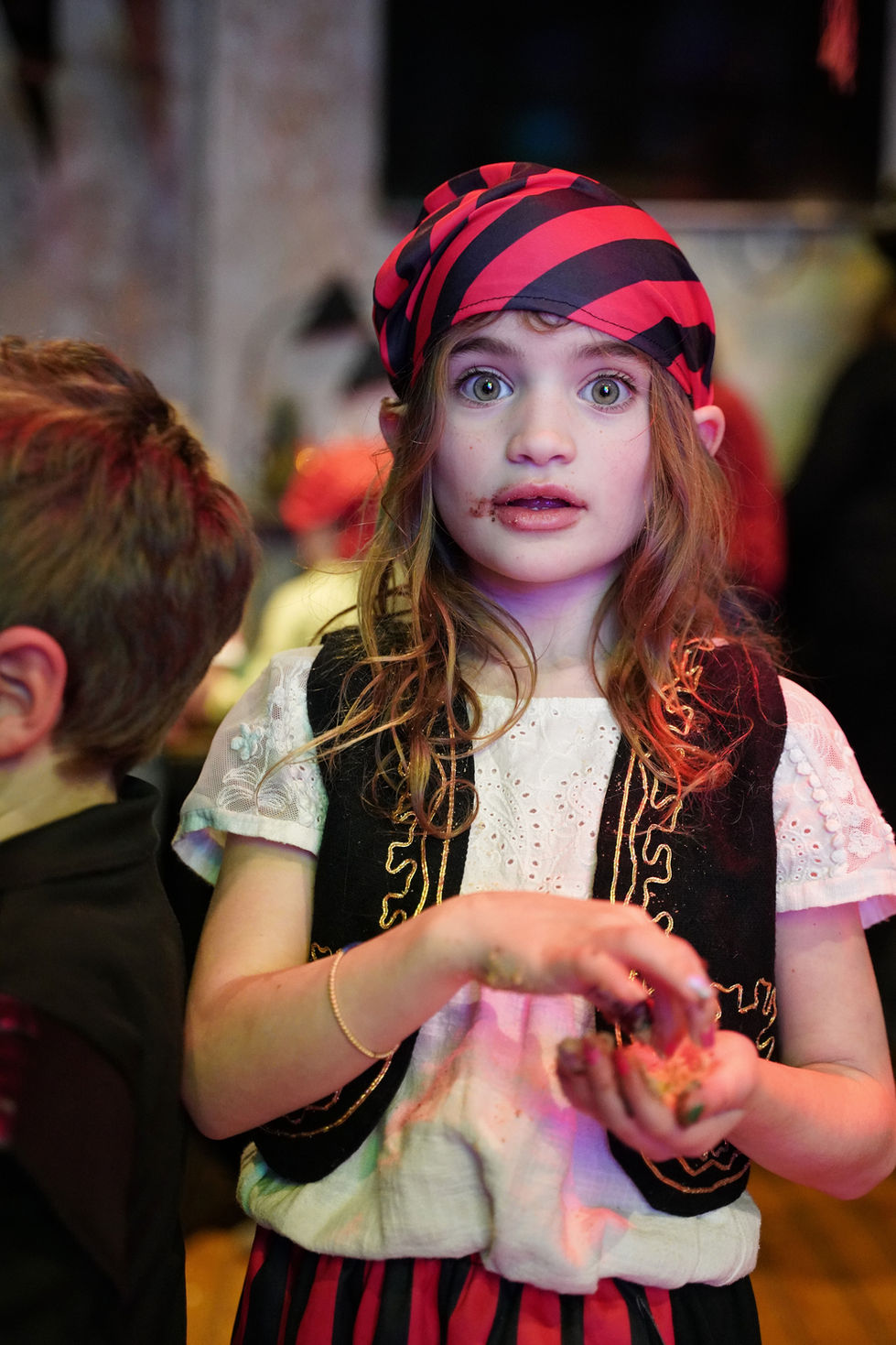 Girl in pirate costume, surprised expression