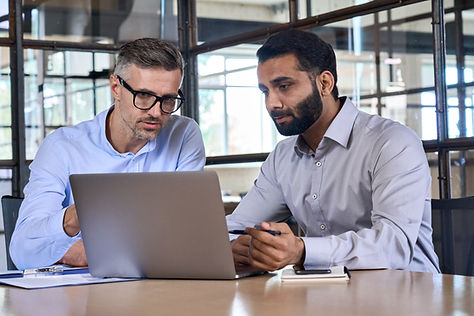 two-business-men-analysts-discussing-data-manageme-2021-11-08-16-18-50-utc.jpg