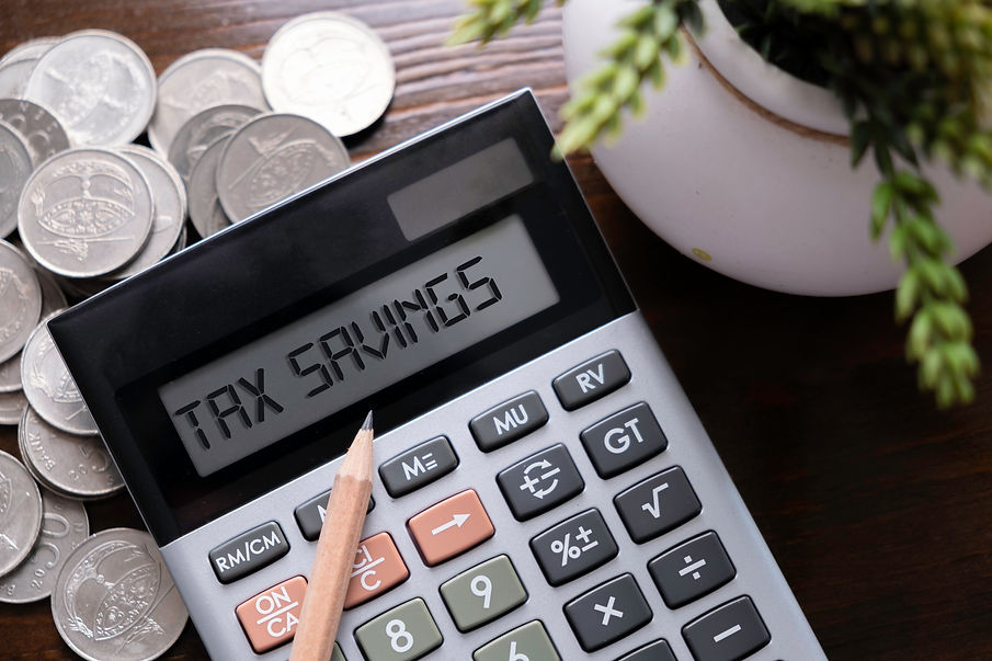 Calculator with text Tax Savings. Business, finance conceptual. .jpg