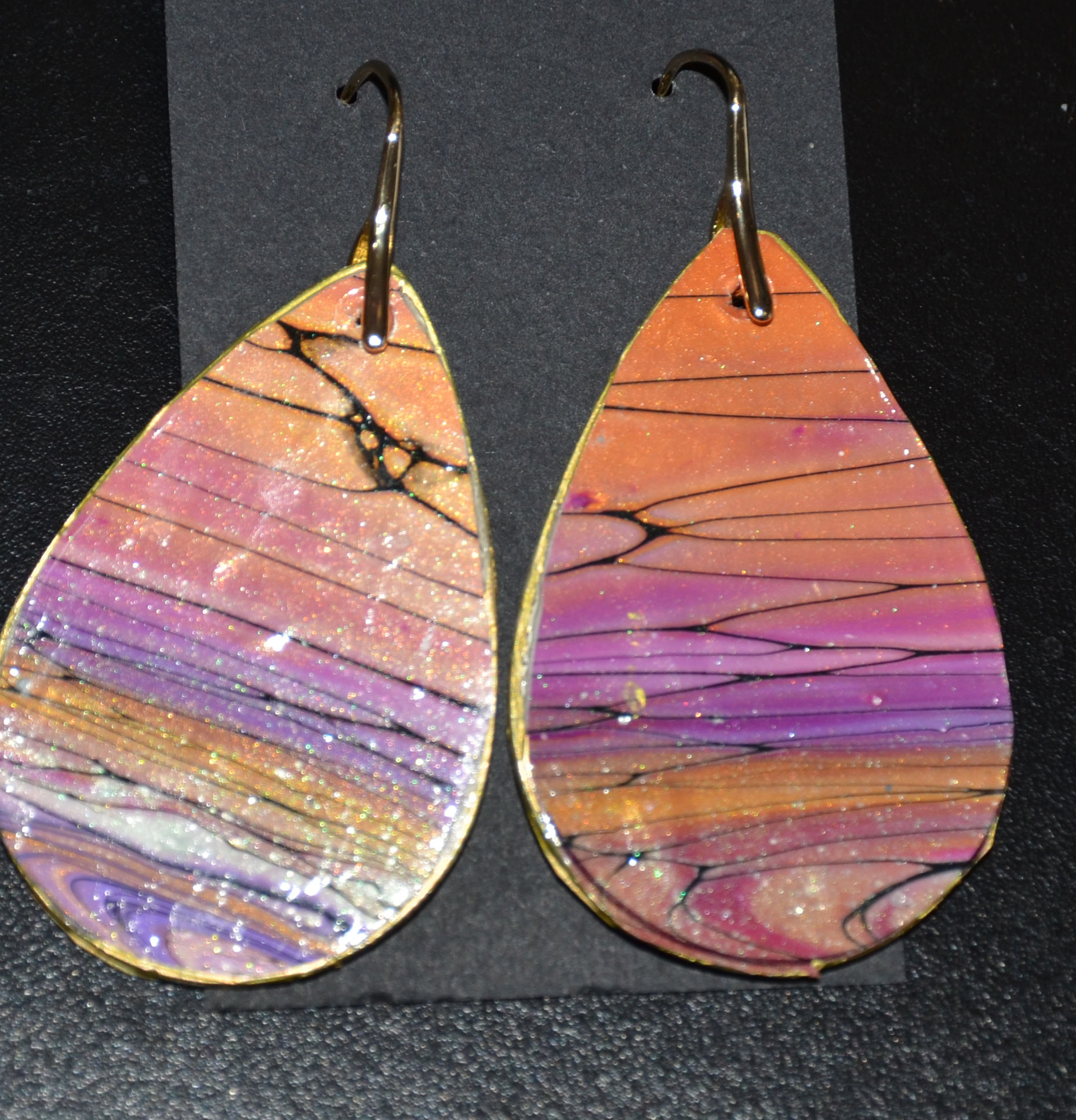 Large earrings  hand crafted with acrylic pour.