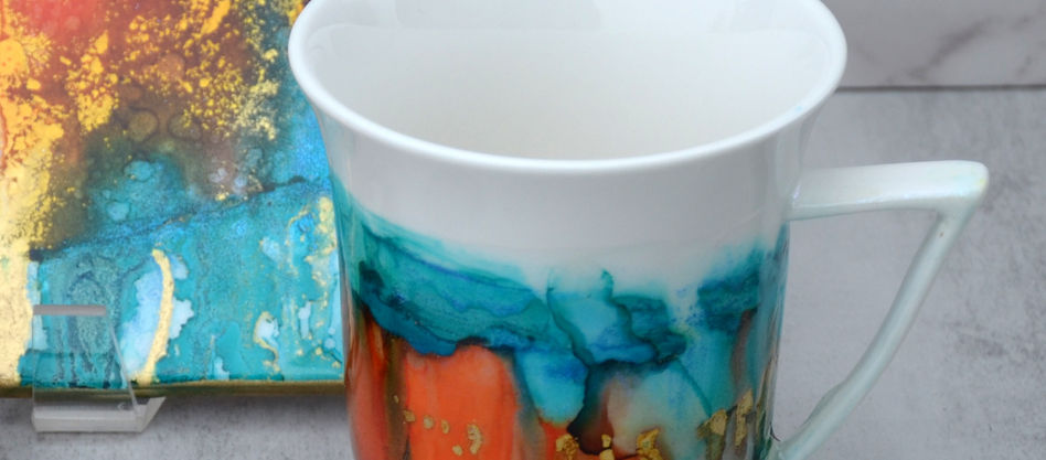 Cup with coaster, hand painted with alcohol ink coated with food safe resin finish.