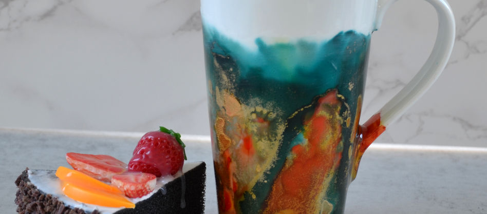 Hand painted mug with alcohol ink, teal, gold and orange.