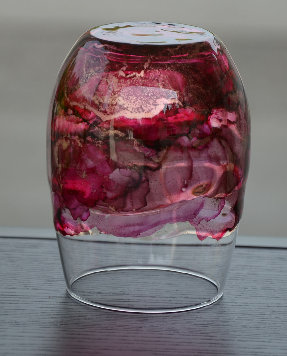 Hand painted with alcohol ink and finished with food safe resin.