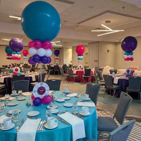 LED centerpiece stand with large balloon topper and a logo add on 