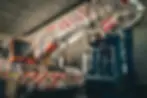 Image of Truckrite's workshop featuring a crane truck with 'Tiger Crane' branding under repair, with two technicians working