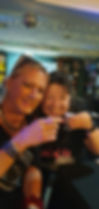 Two Queer and Now members holding their shot glasses together