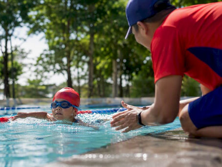 Child swimming face-down in pool