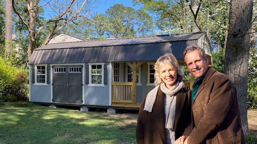 Happy couple with newly delivered backyard shed