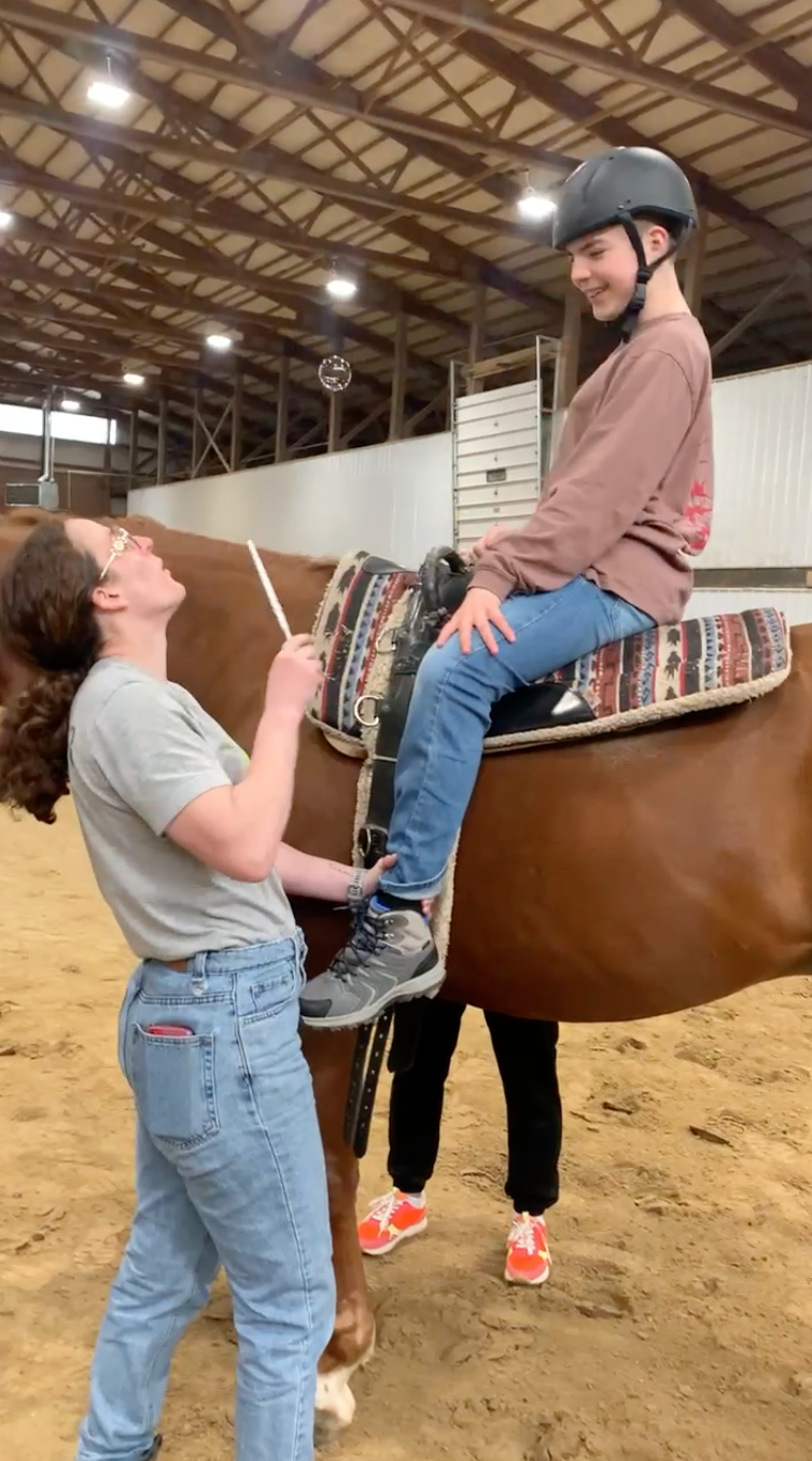 Kenzie and Dylan are blowing bubbles.