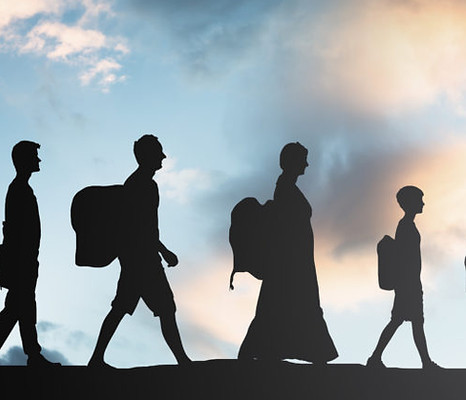 Refugees-People-With-Luggage-Walking-In-A-Row-purchased-stock-photo-1024x683.jpg
