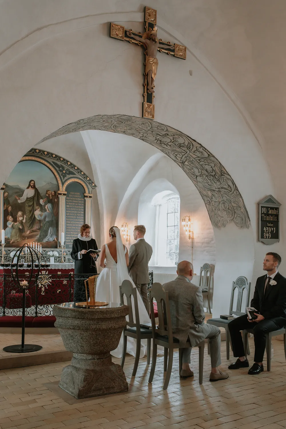 Elegant Scandinavian wedding ceremony inside historic Danish church