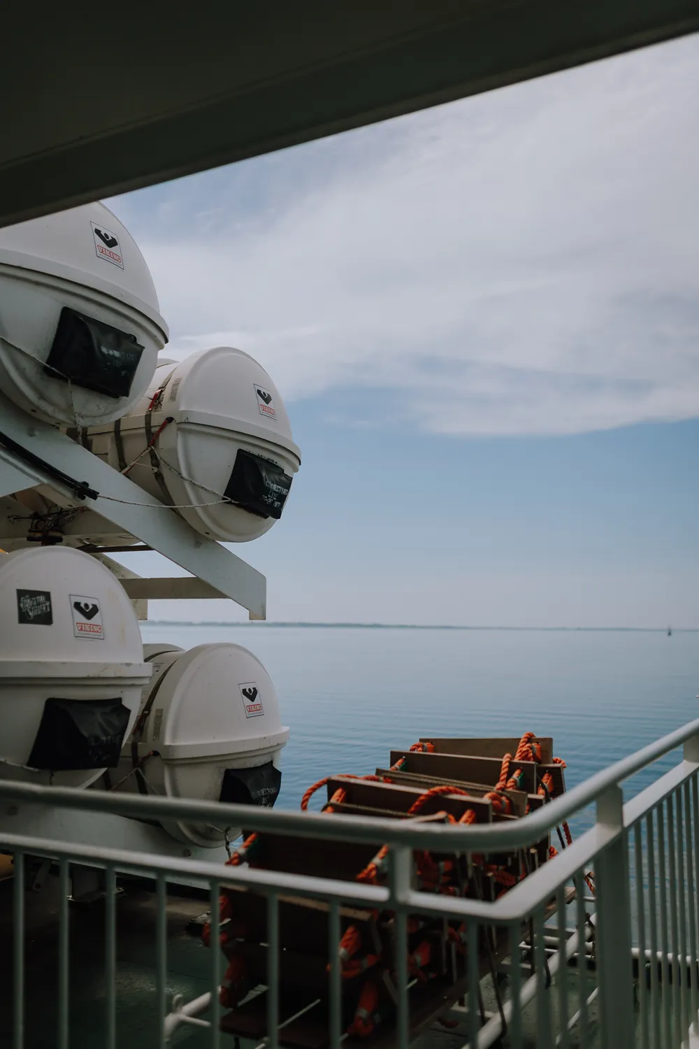 Ferry journey to Ærø with Danish flag, sea views and island wedding travel atmosphere.