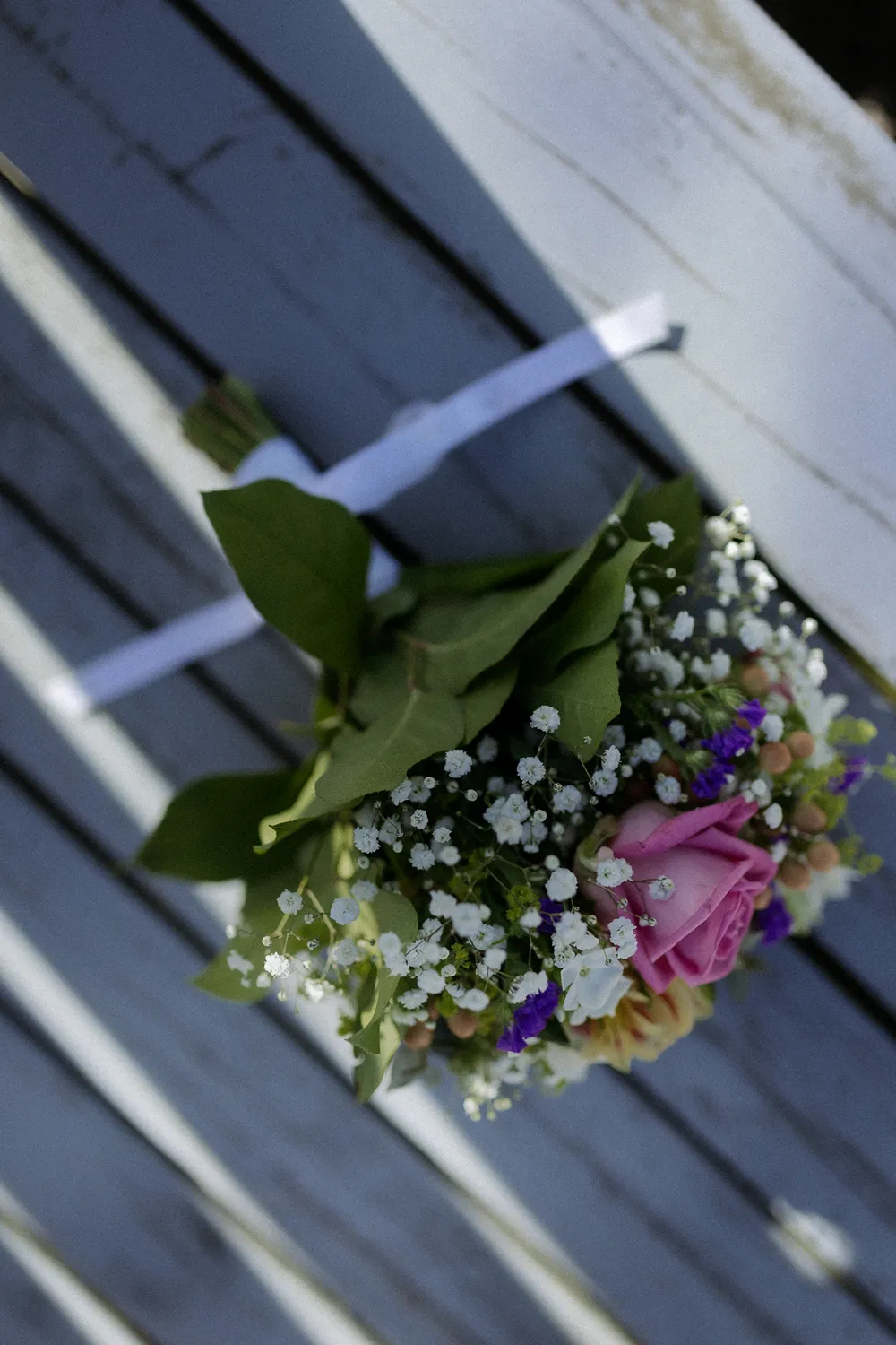 Documentary wedding portrait near colourful Danish architecture in Ærøskøbing.
