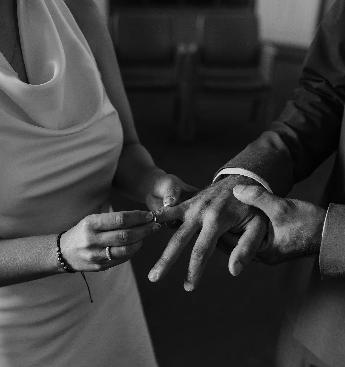 Couple exchanging rings during an Odense City Hall wedding ceremony.