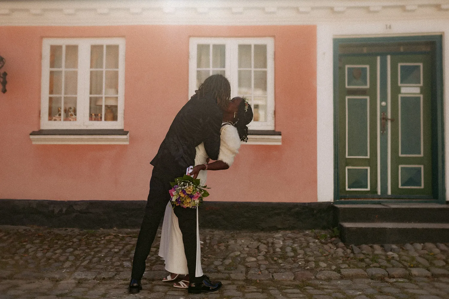 Historic pastel houses in Ærøskøbing during intimate spring wedding.
