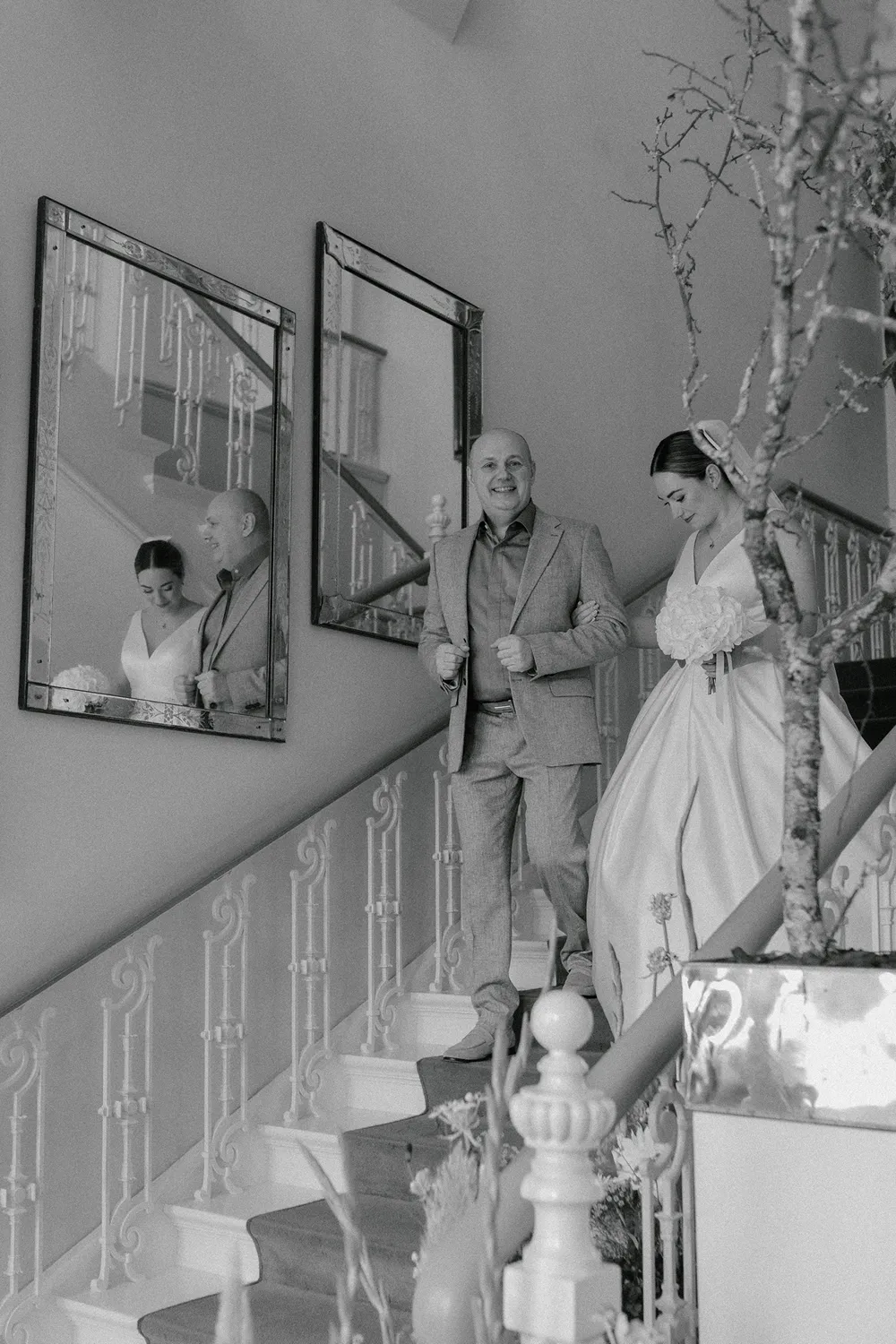 Elegant staircase bridal portrait at Danish castle wedding