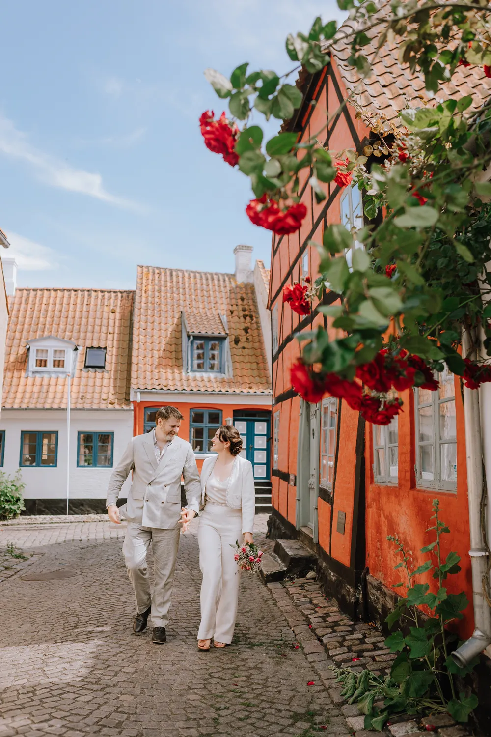 Ferry journey to Ærø with Danish flag, sea views and island wedding travel atmosphere.