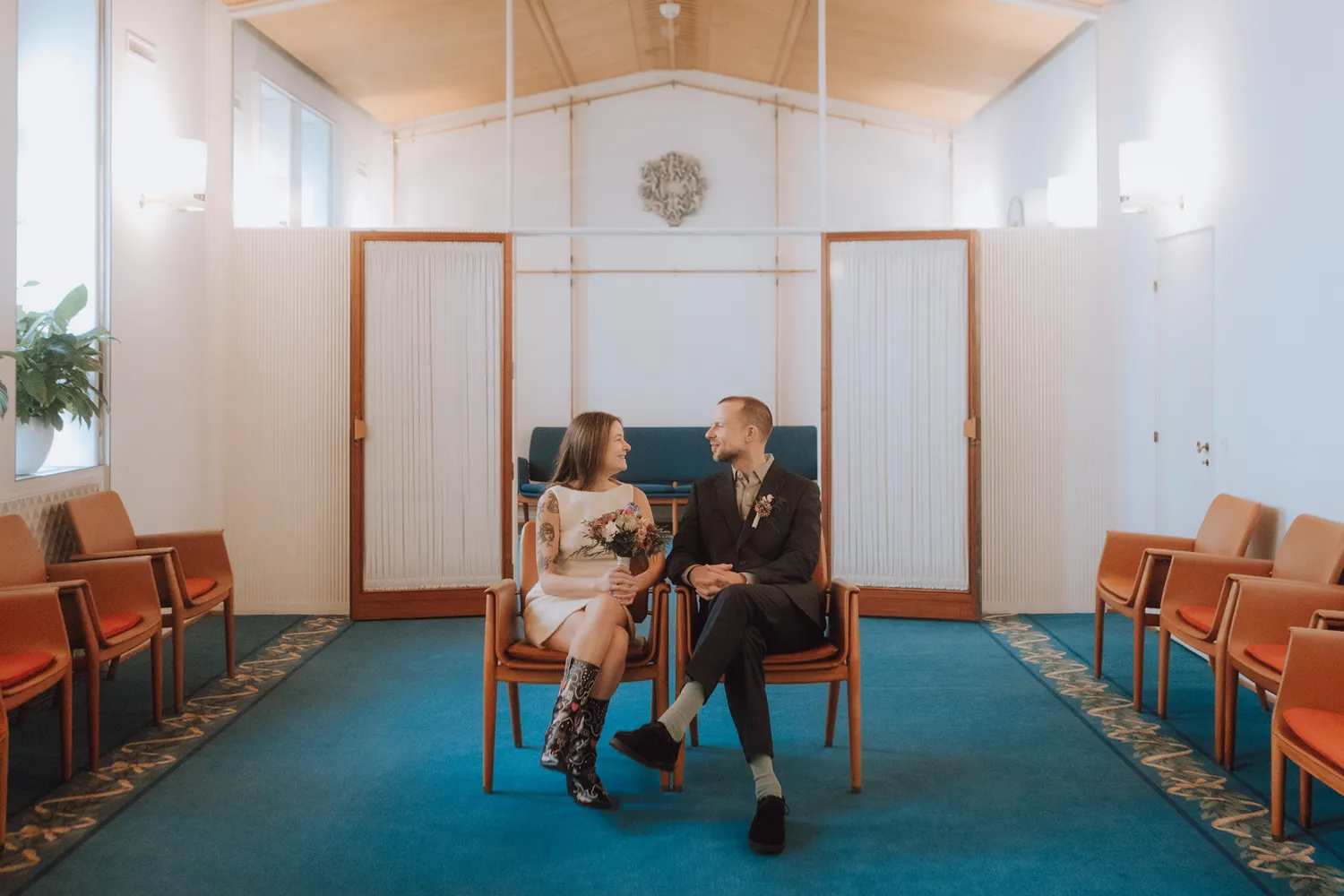 Intimate wedding ceremony in Odense with soft spring light.