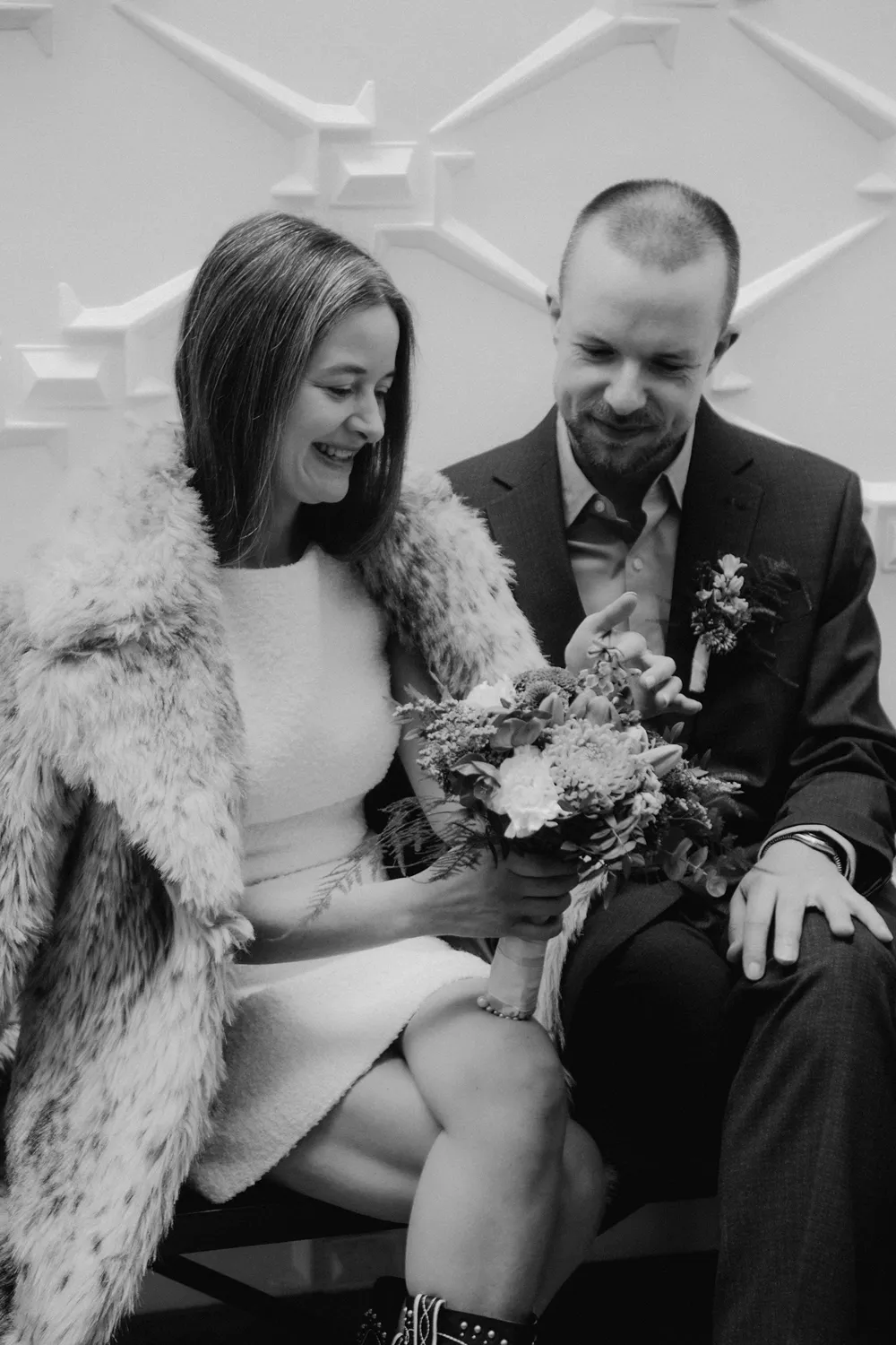 Couple laughing together during relaxed city hall wedding in Denmark.