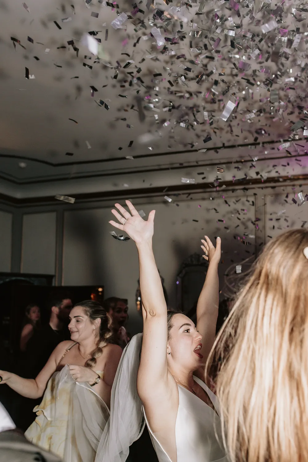 Confetti wedding party moment at Holckenhavn Slot