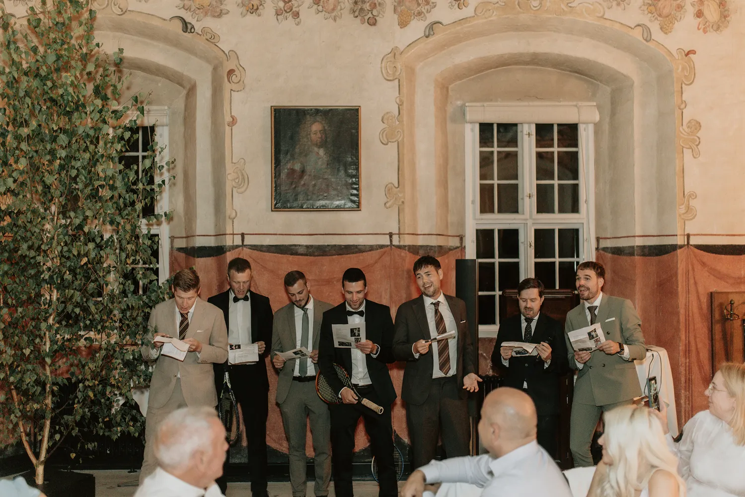 Elegant wedding party inside Danish castle venue by Juniper Picture Lab