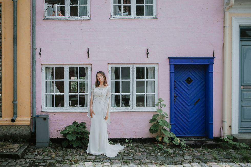 Relaxed wedding portraits in Ærøskøbing with historic houses and soft island light.