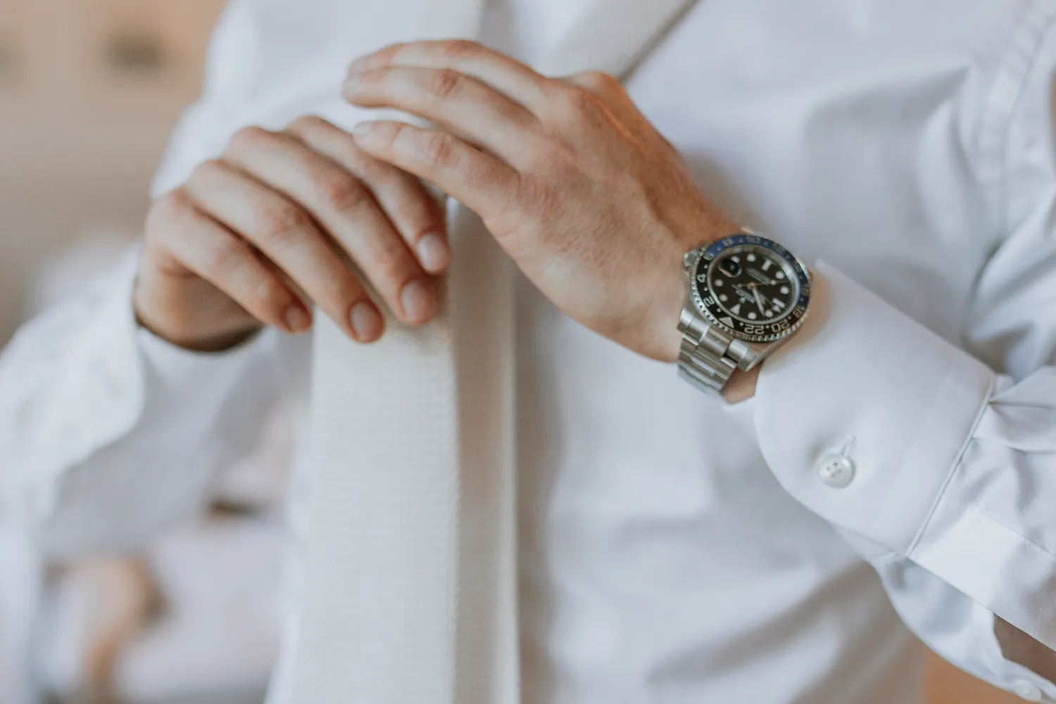 detail of Groom getting ready at Holckenhavn  slot wedding venue in Denmark