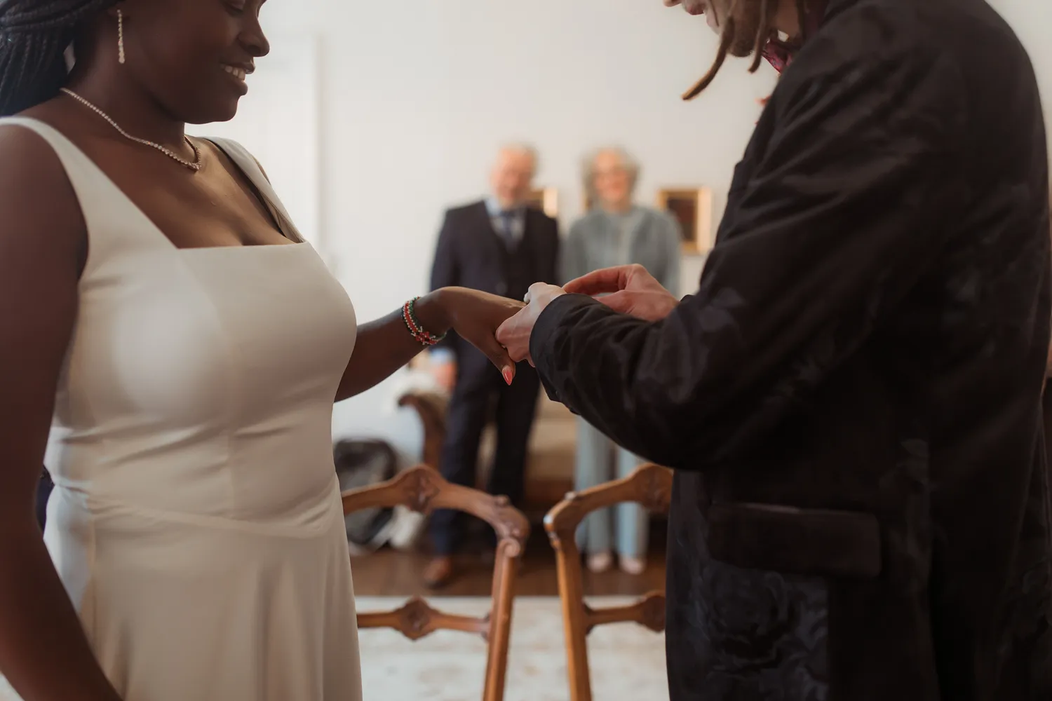 Close-up photograph of custom wedding rings during civil ceremony in Denmark.