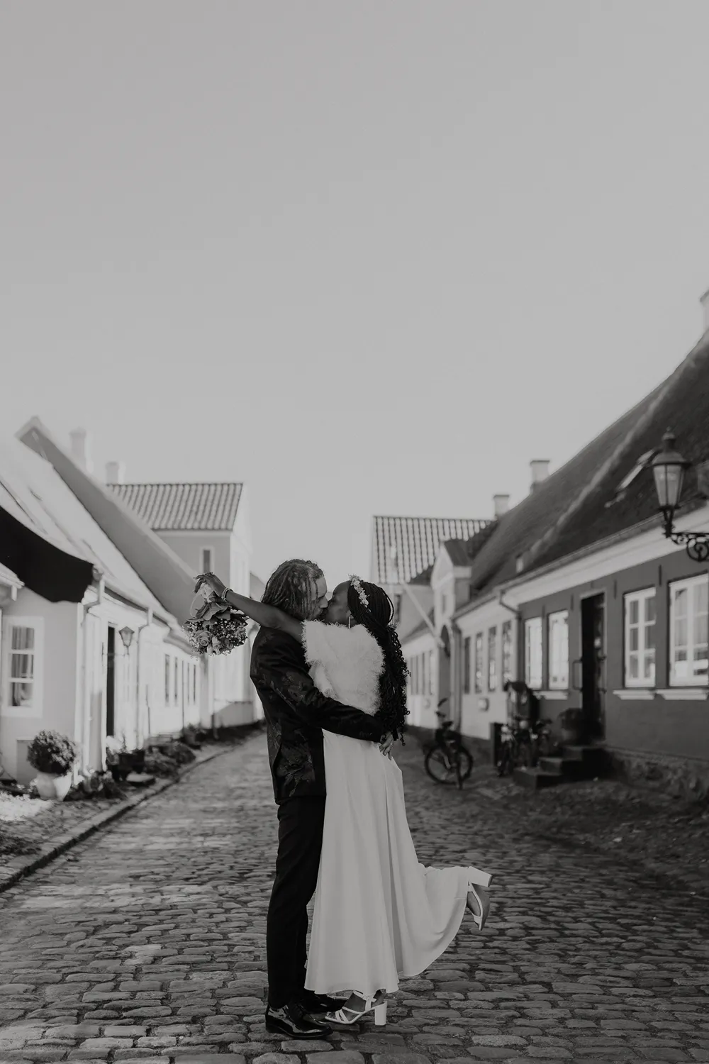 Intimate wedding portraits in the historic streets of Ærøskøbing destination wedding  photographed by Juniper Picture Lab
