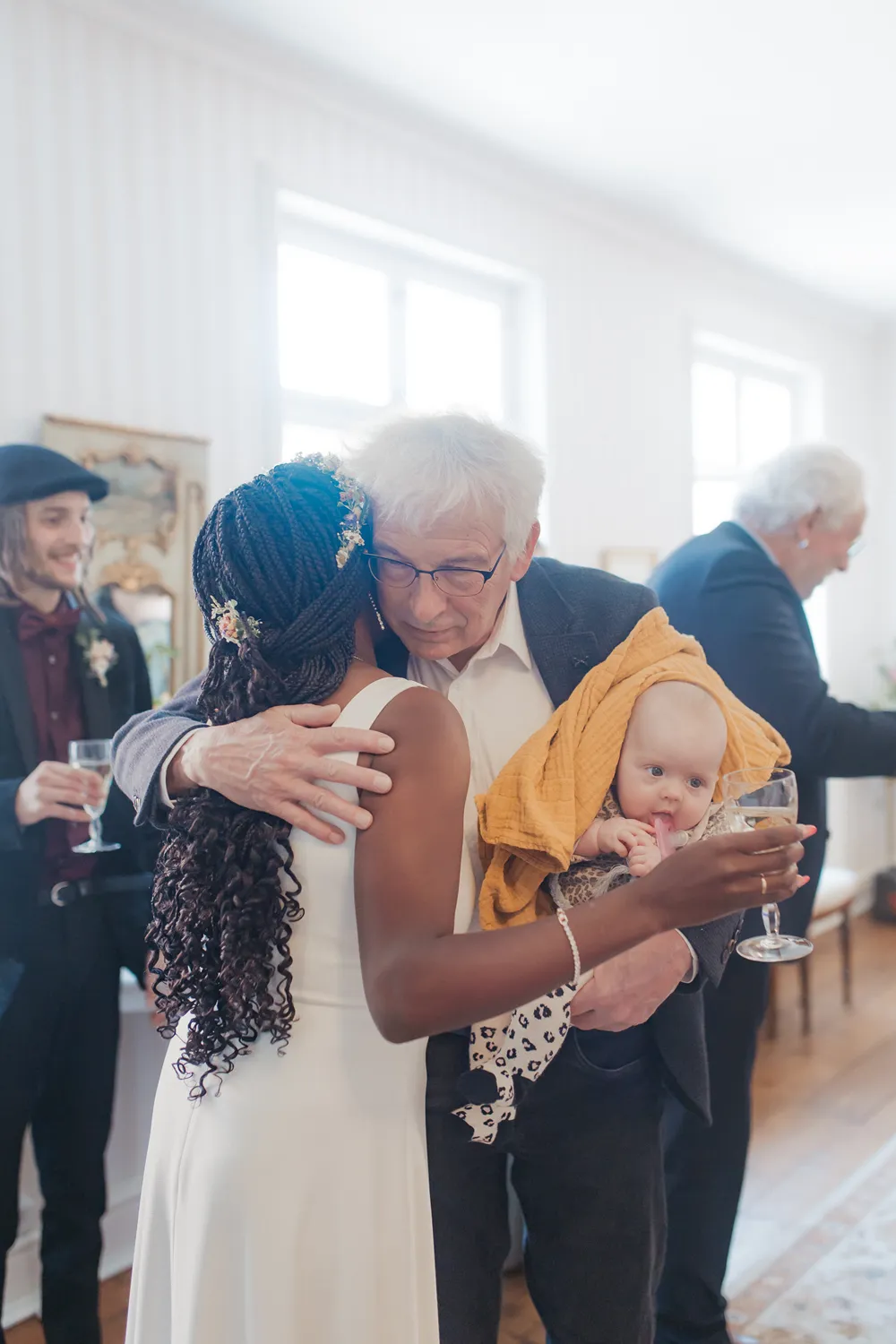 Wedding guests gathered during intimate ceremony in Ærøskøbing.