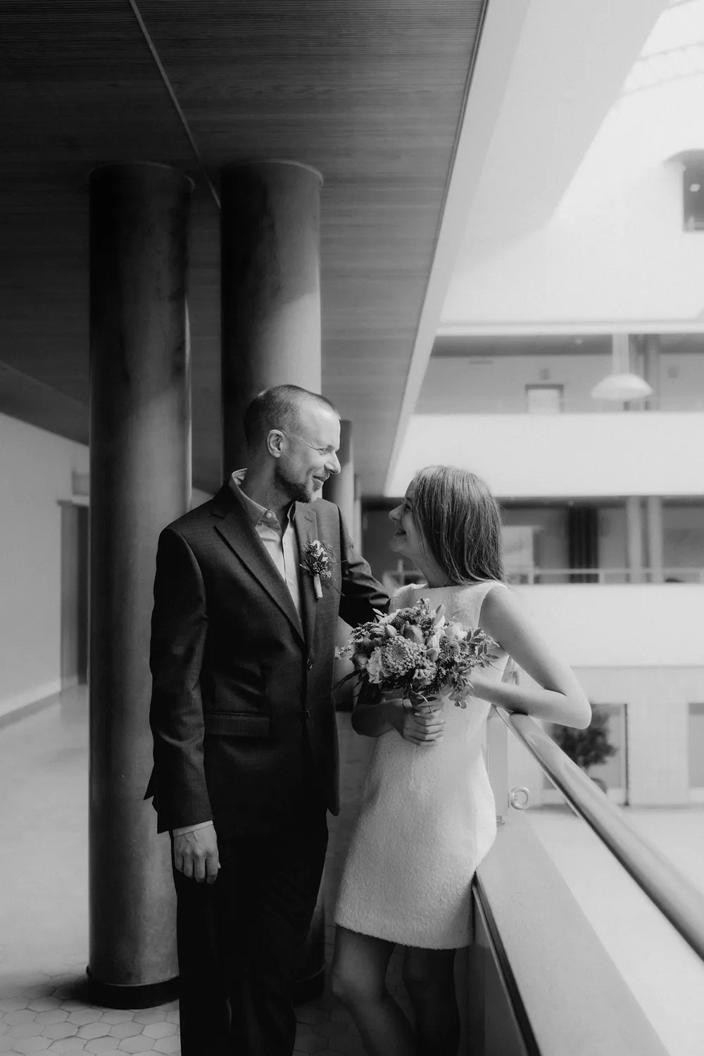 Black and white wedding photography inside Odense City Hall.