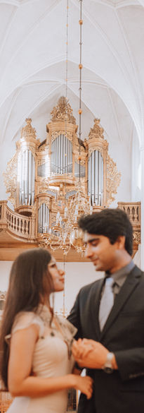 Couple illuminated by soft Scandinavian daylight during wedding in Church