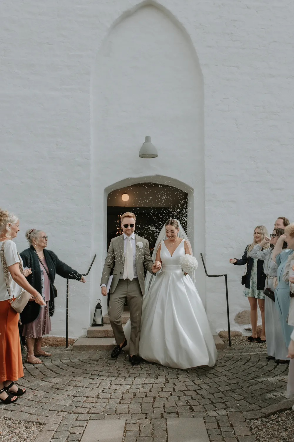 Newlyweds celebrating outside church 