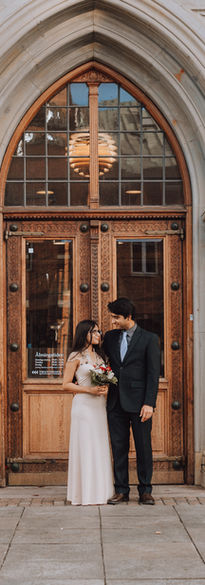 Couple holding hands during quick Denmark civil ceremony.