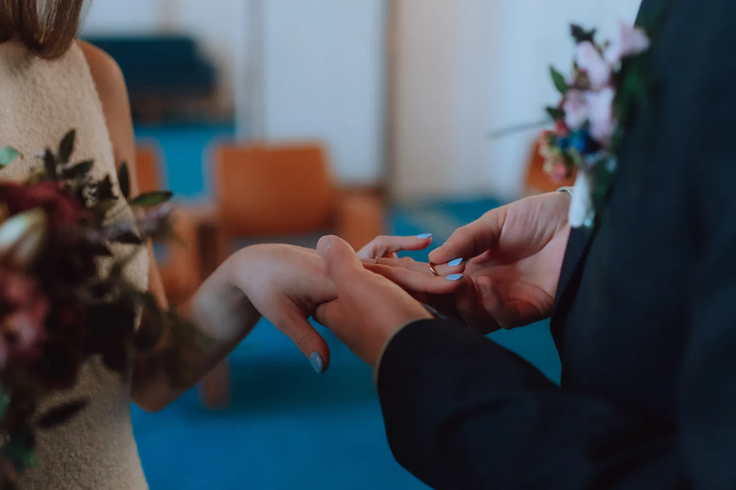 Wedding ring exchange during intimate civil ceremony in Denmark.