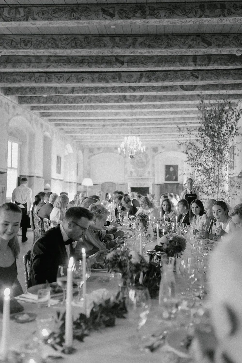 Luxury Danish castle wedding guests during speeches by Juniper Picture Lab