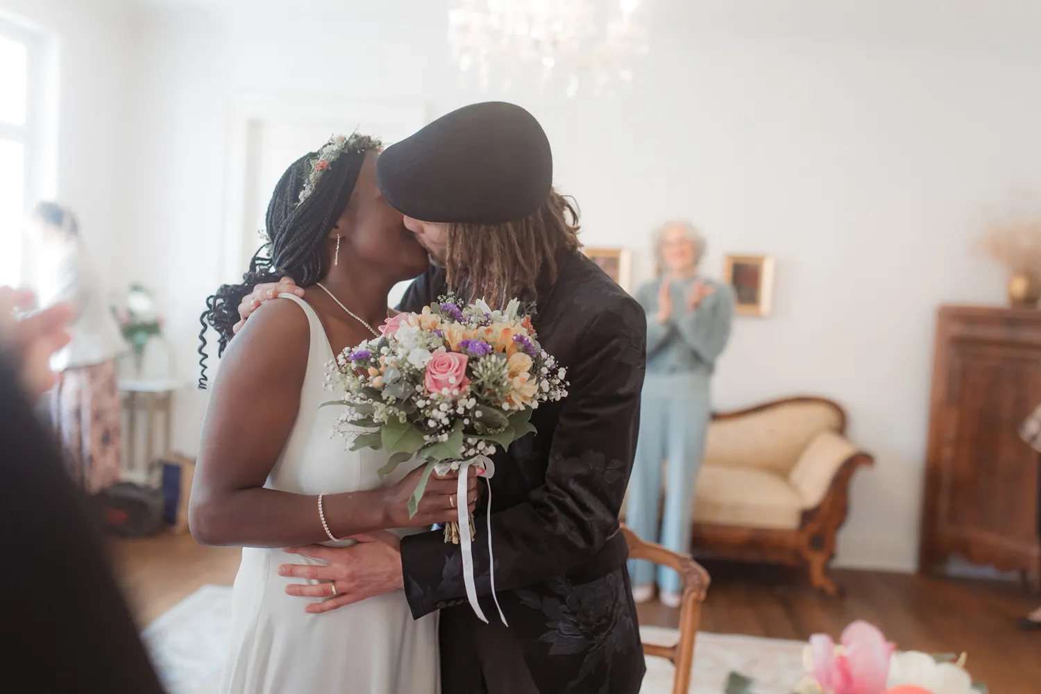 Newly married couple sharing their first kiss during wedding ceremony on Ærø.