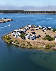 An aerial view of a peninsula surrounded by water for campers on the Oregon coast